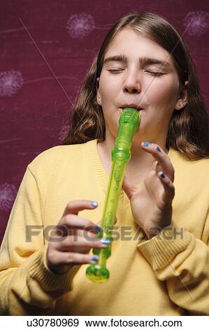 Stock Photo - Young girl playing recorder. Fotosearch