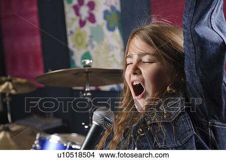Young girl singing in studio View Large Photo Image Picture - Young girl singing in studio. Fotosearch