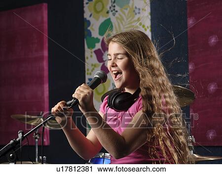 Young girl singing in studio View Large Photo Image Stock Image - Young girl singing in studio. Fotosearch