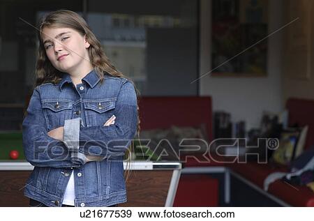 Young girl standing near pool table View Large Photo Image Stock Photo - Young girl standing near pool table. Fotosearch