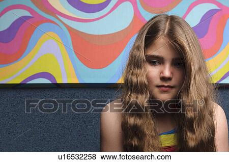 Young girl with abstract painting View Large Photo Image Stock Photo - Young girl with abstract painting. Fotosearch