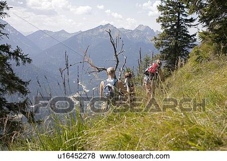 Young girls roaming through the Alps View Large Photo Image Stock Photo - Young girls roaming through the Alps. Fotosearch