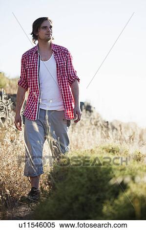 Young man hiking View Large Photo Image Stock Photography - Young man hiking. Fotosearch