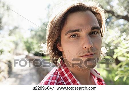 Young man in nature portrait View Large Photo Image Stock Photo - Young man in nature portrait. Fotosearch