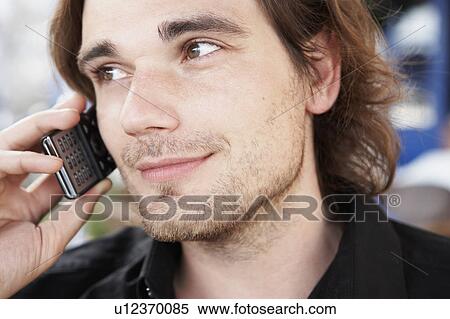 Stock Photography - Young man phoning. Fotosearch