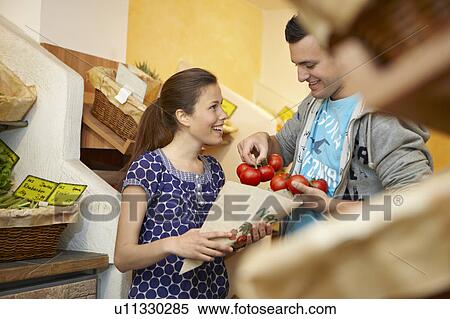 Young people buying fruits and vegetable View Large Photo Image Stock Photography - Young people buying fruits and vegetable. Fotosearch