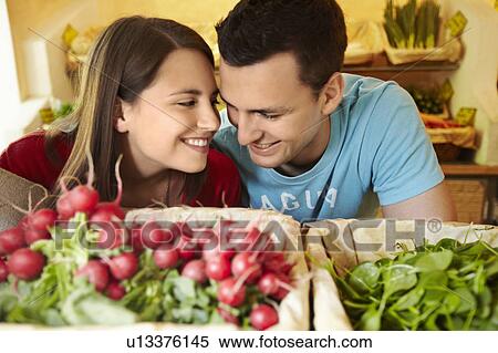 Young people buying fruits and vegetable View Large Photo Image Stock Photography - Young people buying fruits and vegetable. Fotosearch