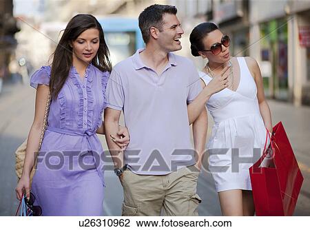 Young people shopping View Large Photo Image Stock Image - Young people shopping. Fotosearch