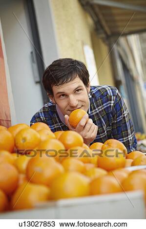 Young person in a fruit stall View Large Photo Image Stock Image - Young person in a fruit stall. Fotosearch