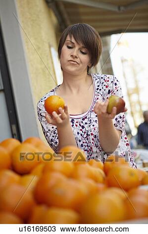 Young person in a fruit stall View Large Photo Image Stock Image - Young person in a fruit stall. Fotosearch