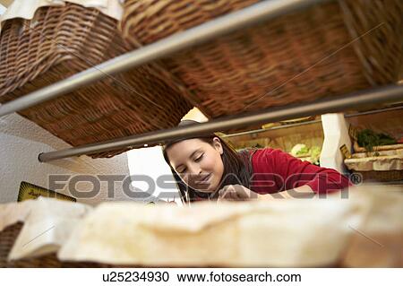 Young person in a fruit stall View Large Photo Image Stock Image - Young person in a fruit stall. Fotosearch