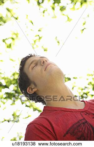 Young person leisurely in a park View Large Photo Image Stock Photo - Young person leisurely in a park. Fotosearch