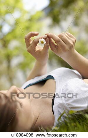 Young person leisurely in a park View Large Photo Image Stock Photo - Young person leisurely in a park. Fotosearch