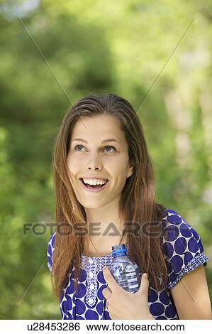 Stock Photograph - Young person leisurely in a park. Fotosearch