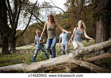 Young persons running together in nature View Large Photo Image Stock Image - Young persons running together in nature. Fotosearch