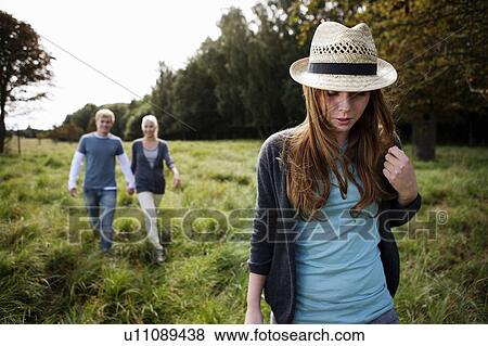 Stock Photo - Young persons walking in nature. Fotosearch