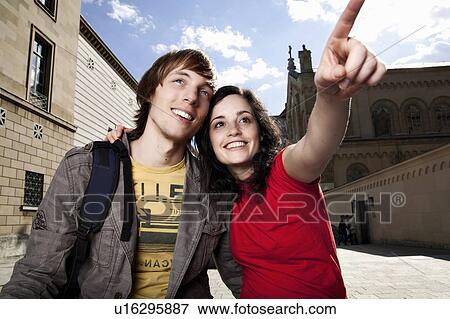Stock Photo - Young tourist couple sightseeing. Fotosearch