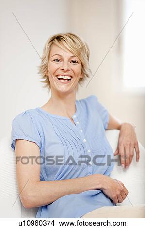 Young woman at home View Large Photo Image Picture - Young woman at home. Fotosearch