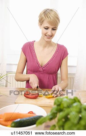 Young Woman at Home Preparing Food View Large Photo Image Stock Image - Young Woman at Home Preparing Food. Fotosearch