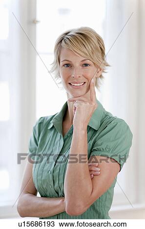 Young woman at home View Large Photo Image Stock Image - Young woman at home. Fotosearch
