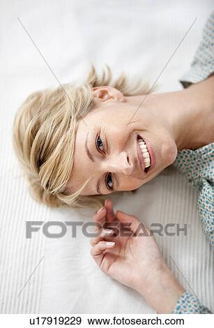 Stock Photo - Young woman at home. Fotosearch