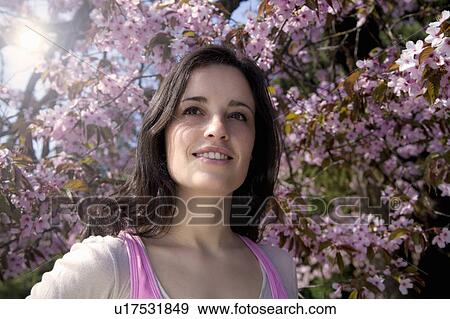 Young woman enjoying the sun View Large Photo Image Stock Photo - Young woman enjoying the sun. Fotosearch