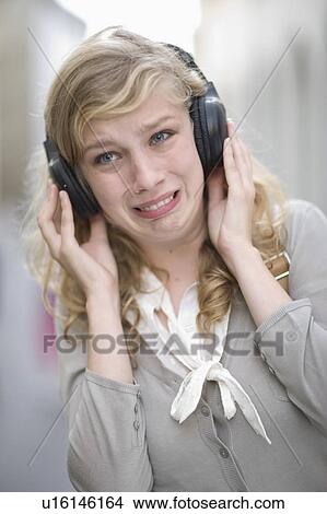 Young woman hearing music View Large Photo Image Picture - Young woman hearing music. Fotosearch