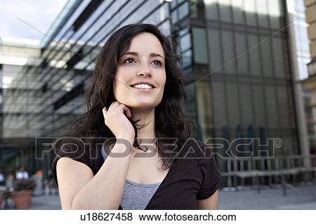 Young woman looking interested View Large Photo Image Stock Photo - Young woman looking interested. Fotosearch