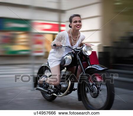 Young woman riding motorcycle View Large Photo Image Stock Photograph - Young woman riding motorcycle. Fotosearch