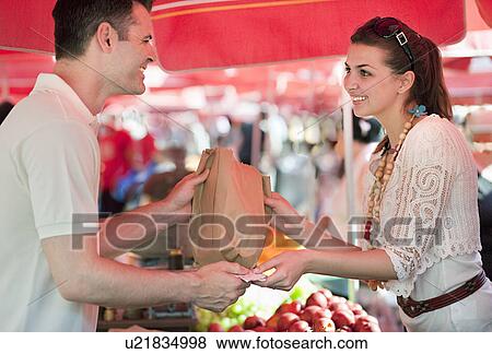 Young woman shopping for fruit View Large Photo Image Stock Photo - Young woman shopping for fruit. Fotosearch