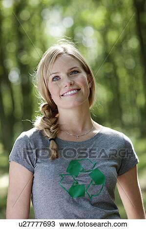 Young woman standing in nature View Large Photo Image Stock Image - Young woman standing in nature. Fotosearch