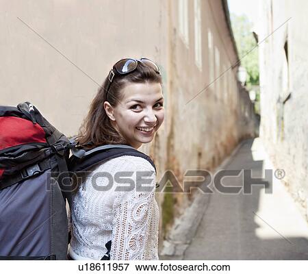 Young woman travelling with backpack View Large Photo Image Stock Photo - Young woman travelling with backpack. Fotosearch