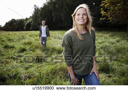 Young woman walking in nature View Large Photo Image Stock Image - Young woman walking in nature. Fotosearch