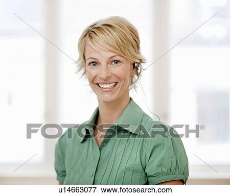 Stock Photo - Young woman with headset. Fotosearch