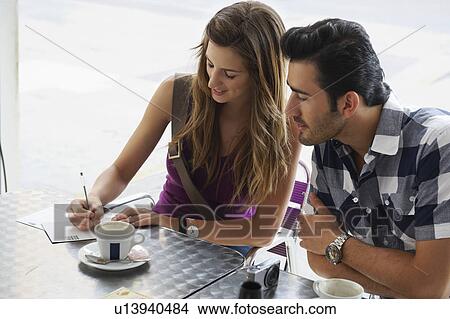 Young woman writing postcards View Large Photo Image Picture - Young woman writing postcards. Fotosearch