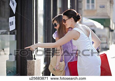 Young women shopping View Large Photo Image Stock Image - Young women shopping. Fotosearch