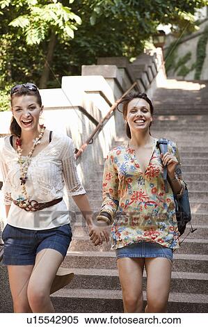 Young women travelling together View Large Photo Image Stock Photography - Young women travelling together. Fotosearch