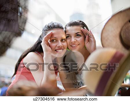 Young women window shopping View Large Photo Image Stock Photograph - Young women window shopping. Fotosearch