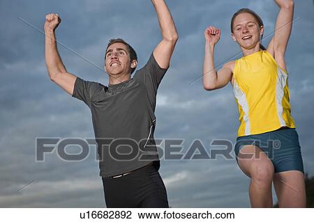 2 athletes celebrating View Large Photo Image Stock Image - 2 athletes celebrating. Fotosearch