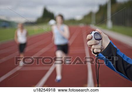 2 female athletes and stopwatch View Large Photo Image Stock Photo - 2 female athletes and stopwatch. Fotosearch