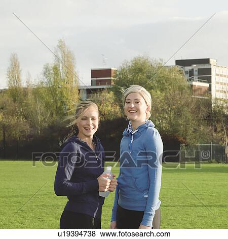 Stock Photo - 2 women in the park. Fotosearch