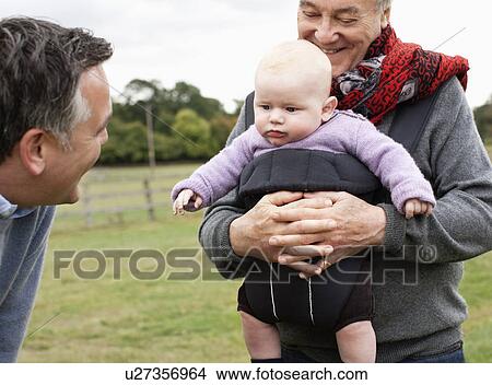 Picture - 3 generations outdoors. Fotosearch