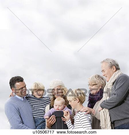 Stock Photo - 3 generations outdoors. Fotosearch