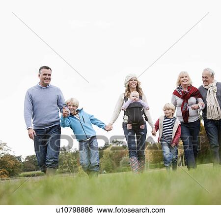 3 generations walking in nature View Large Photo Image Stock Photograph - 3 generations walking in nature. Fotosearch