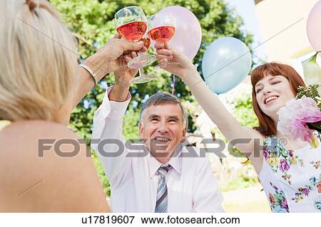3 people raising their glasses. View Large Photo Image Stock Photo - 3 people raising their glasses.. Fotosearch