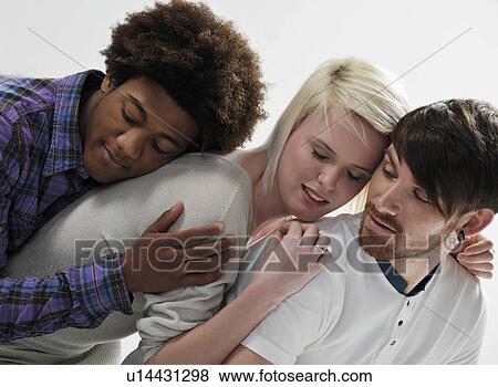 3 young people leaning on each other View Large Photo Image Stock Photo - 3 young people leaning on each other. Fotosearch