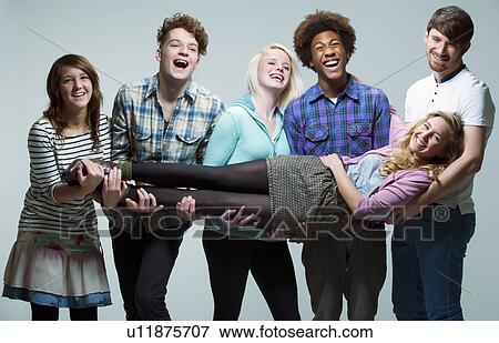 5 young adults carrying young woman View Large Photo Image Stock Photo - 5 young adults carrying young woman. Fotosearch