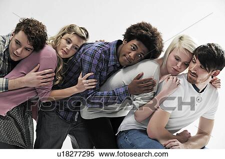 Stock Photography - 5 young people supporting each other. Fotosearch