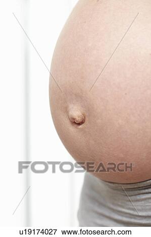 A pregnant belly View Large Photo Image Stock Photo - A pregnant belly. Fotosearch