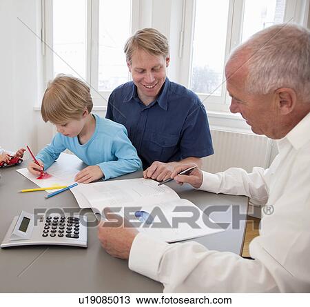 Advisor discussing papers with a father View Large Photo Image Stock Image - Advisor discussing papers with a father. Fotosearch